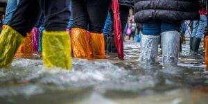 people-wearing-boots-in-a-flood-natural-hazard