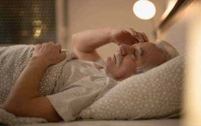 worried-senior-man-thinking-something-while-resting-bed-night